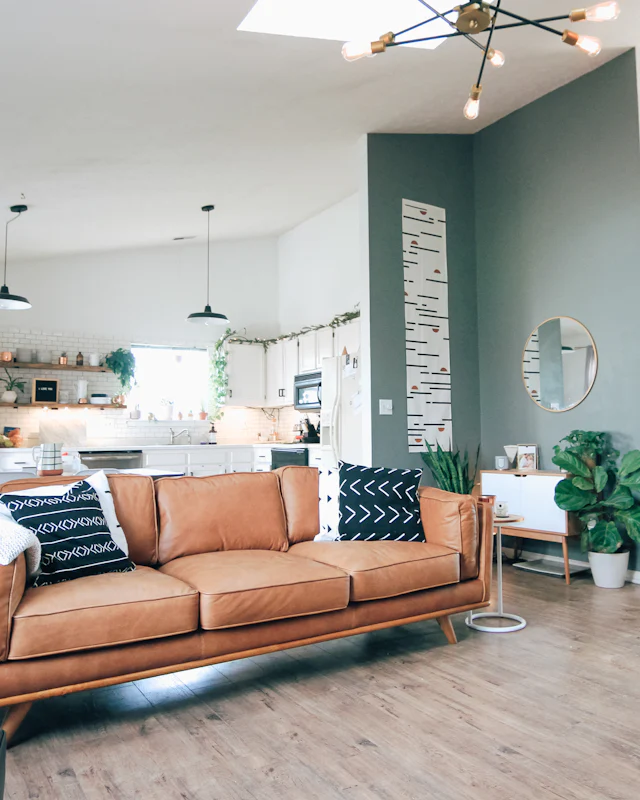 Living room with a leather sofa, clean and tidy
